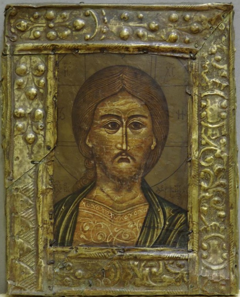 Изображен лик Христа, одетого в зеленую верхнюю и желтую нижнюю одежды, прописанные белым. Фон светло-зеленый.